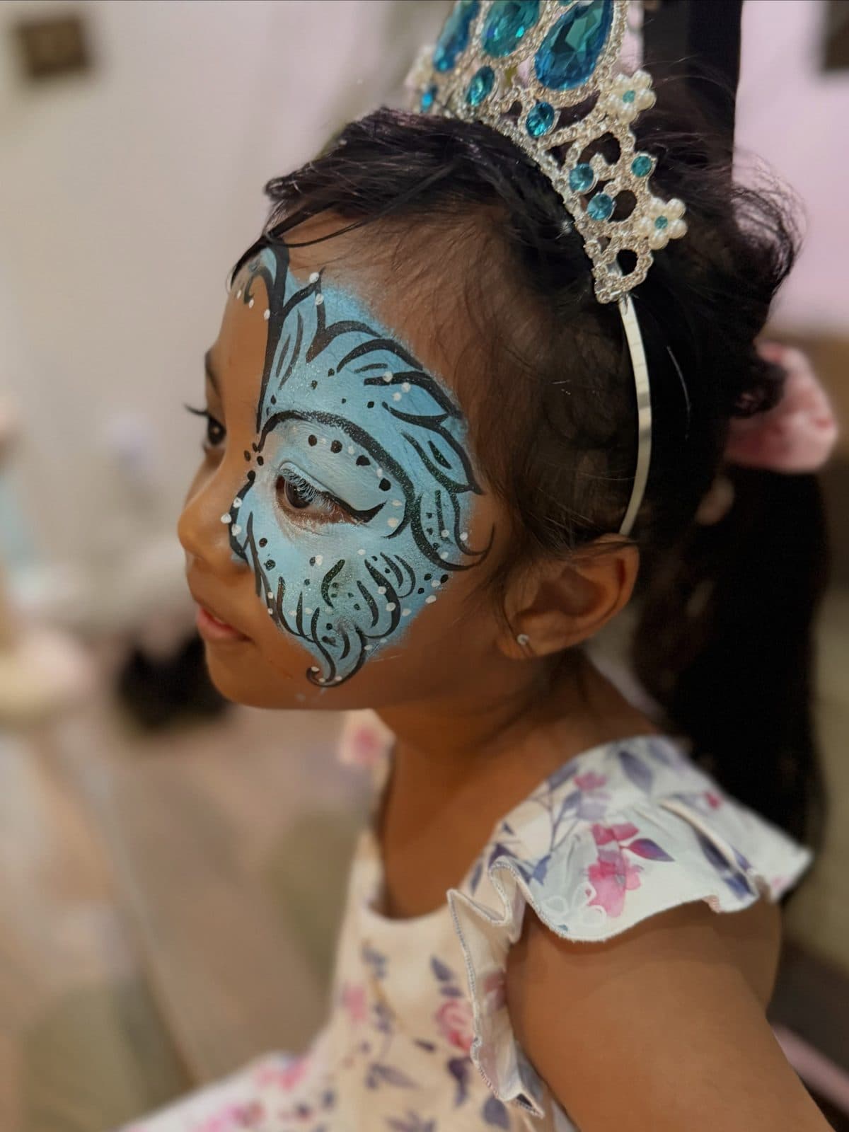 Girl with ice princess face paint